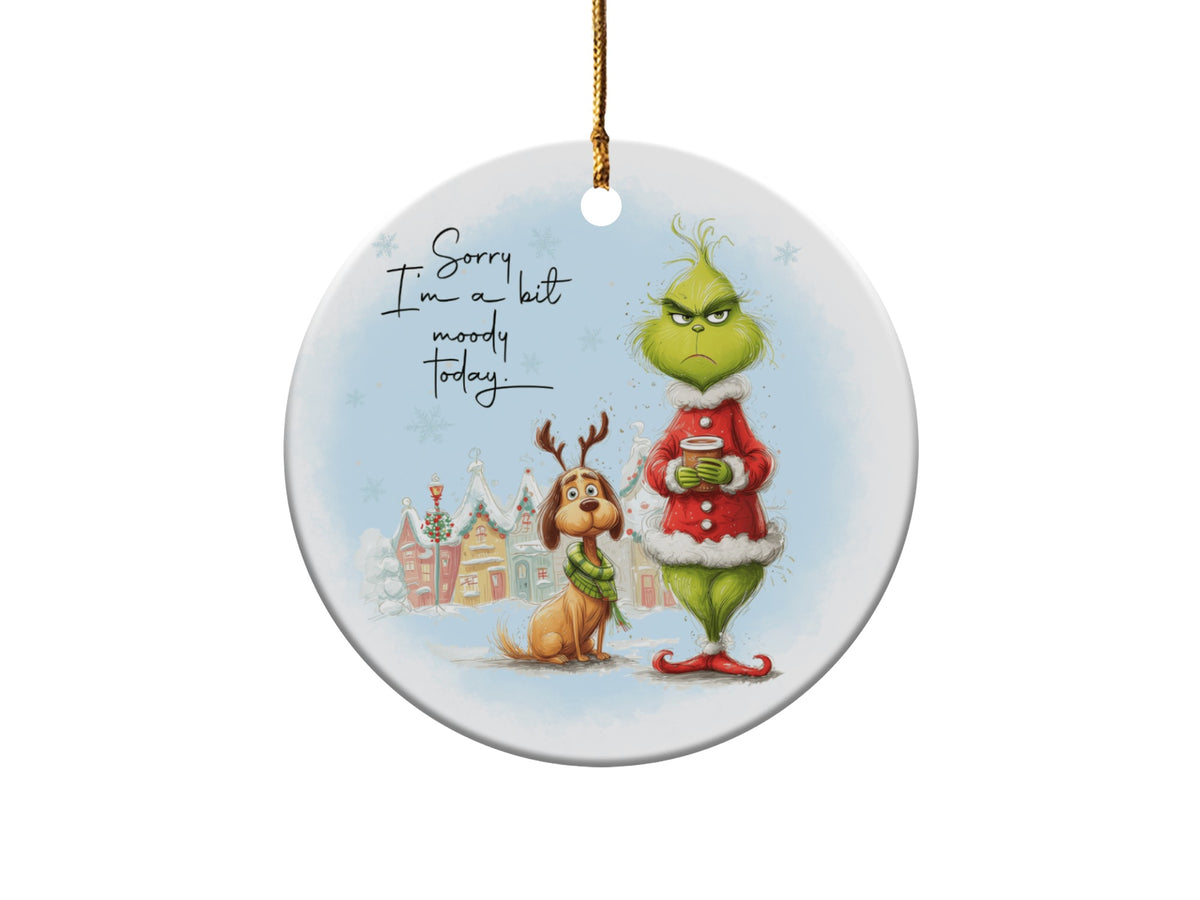 The Grinch and Max sit in a snowy town with text that reads "Sorry I'm a bit moody today."