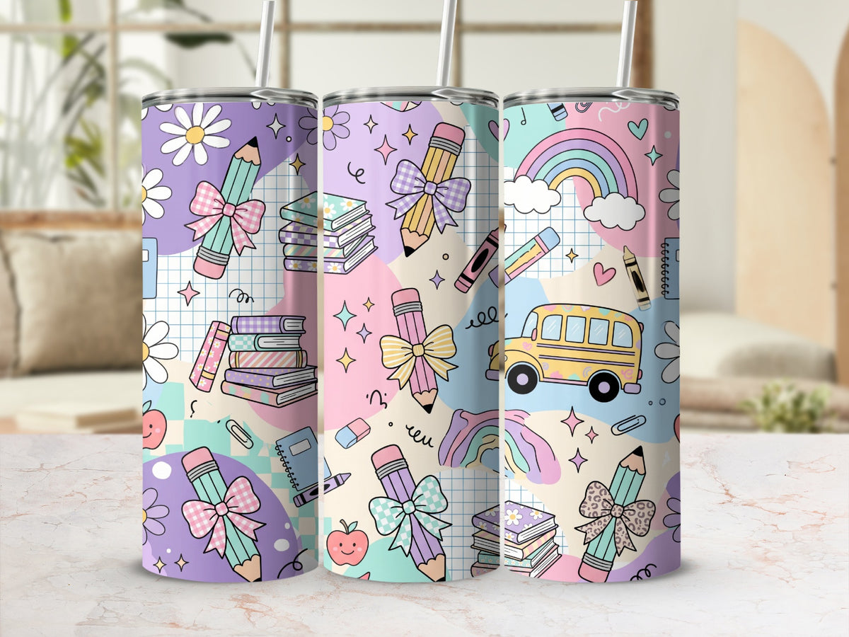 Three tall skinny tumblers feature a pastel school-themed pattern with pencils, books, rainbows, and buses.