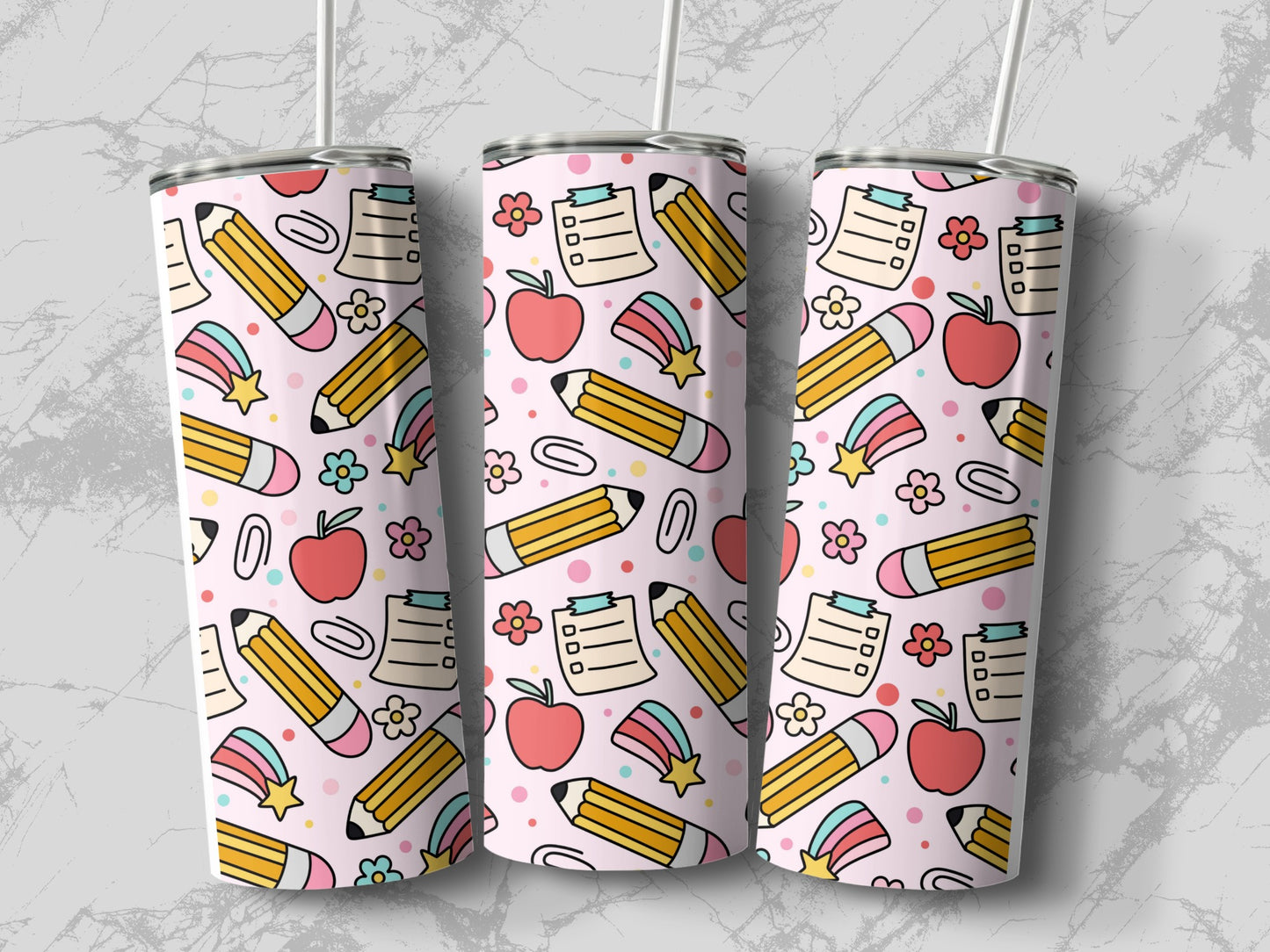 Three tumblers with a repeating pattern of pencils, apples, notes, and flowers on pink.