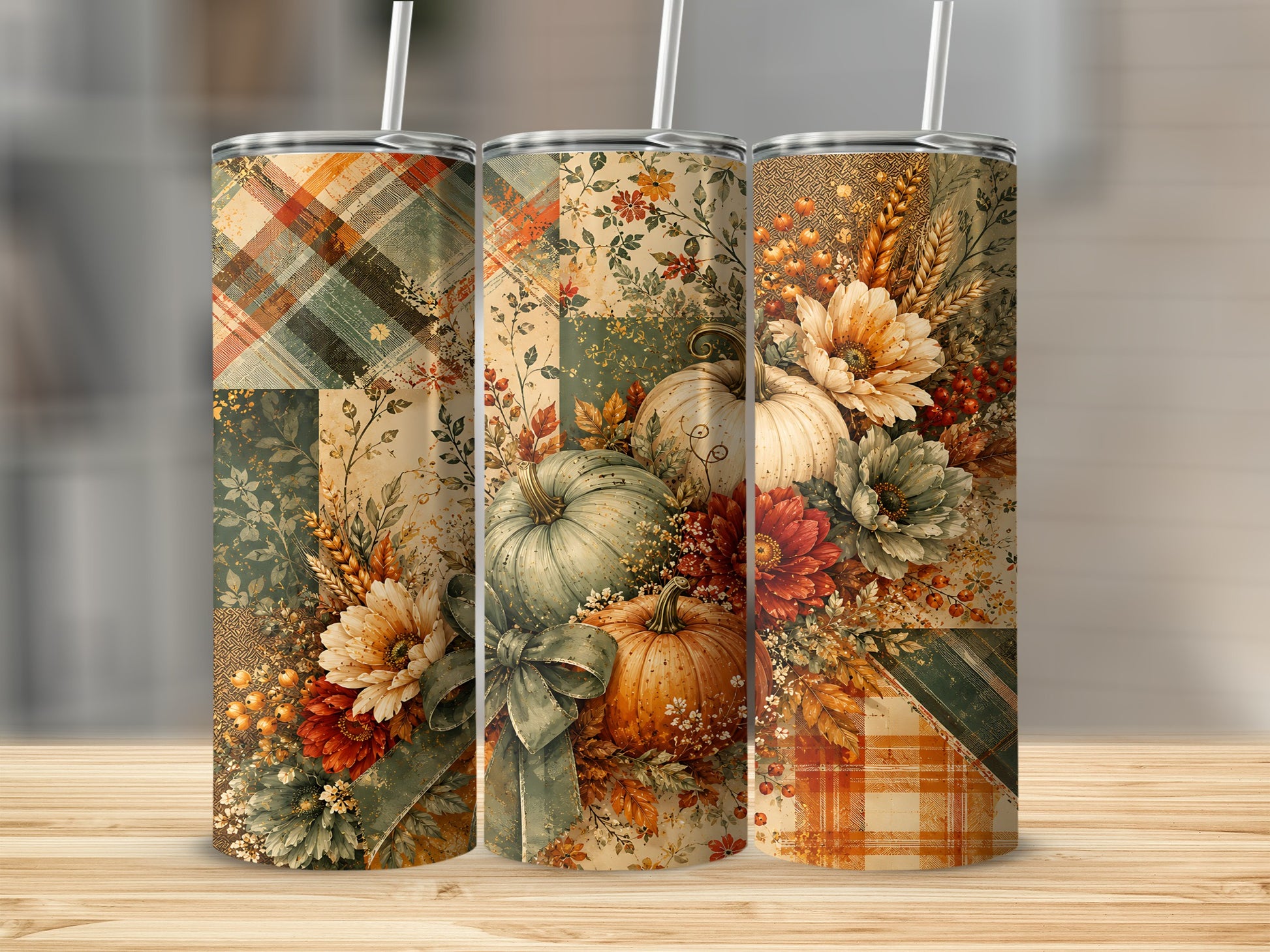 Three tumblers with a patchwork fall design featuring pumpkins, flowers, and plaid patterns.