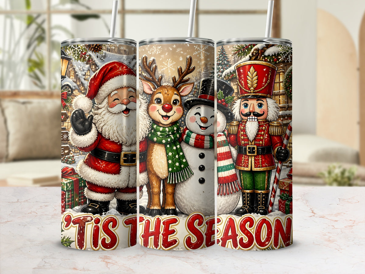 Three tall tumblers display a Christmas-themed design featuring Santa Claus, a reindeer, a snowman, and a nutcracker with the text 'Tis the Season.