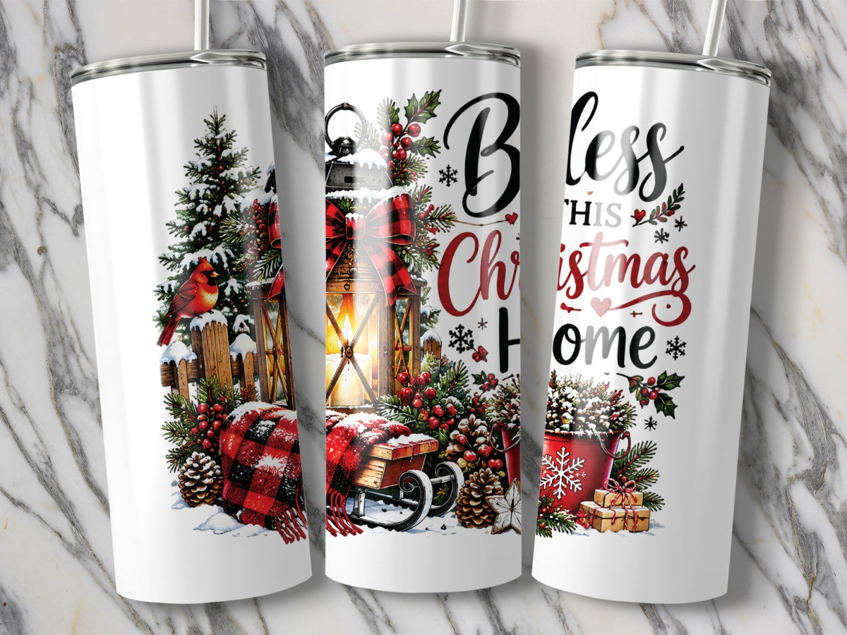 Three white travel tumblers featuring Christmas designs with a cardinal, lantern, evergreen trees, and the text Bless This Christmas Home.