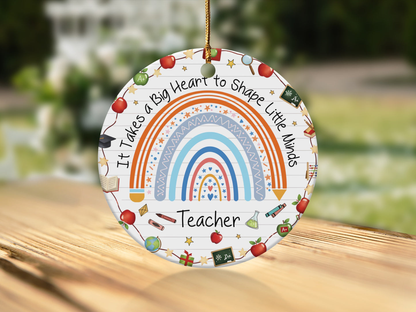 Teacher ornament with rainbow, apples, books, and "It Takes a Big Heart to Shape Little Minds".