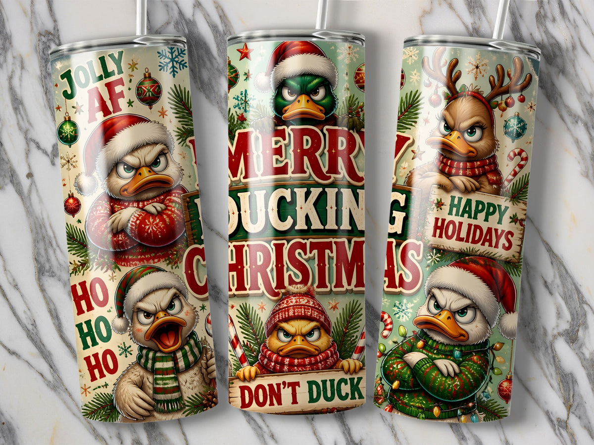 Three tall insulated tumblers display a humorous Christmas pattern featuring grumpy ducks in festive winter clothing.