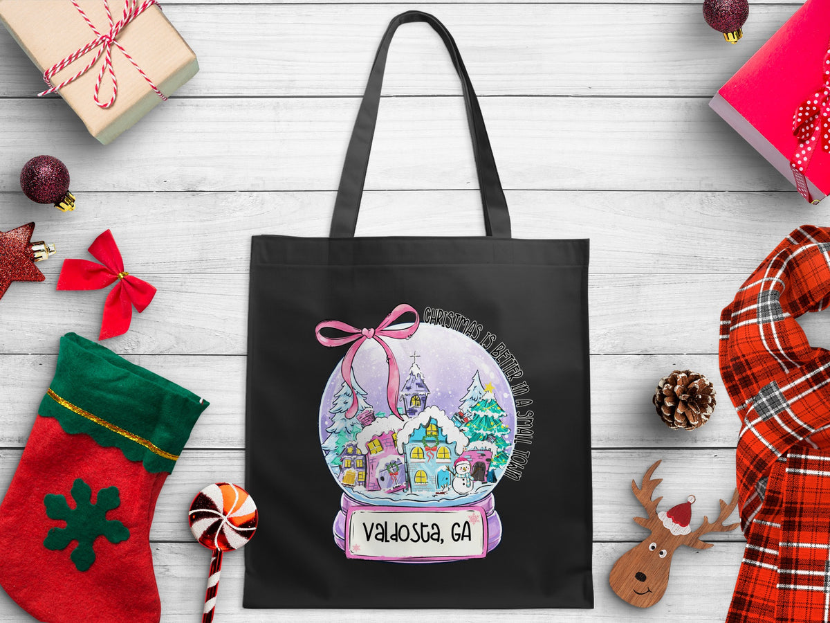 Black tote bag with a Christmas snow globe design and "Valdosta, GA" text.