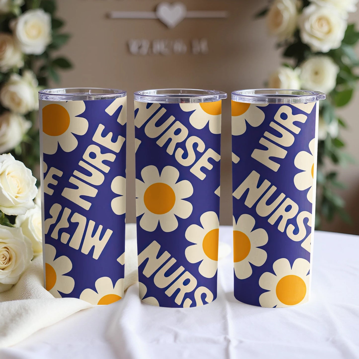 Three nurse tumblers with a blue background and yellow floral pattern.
