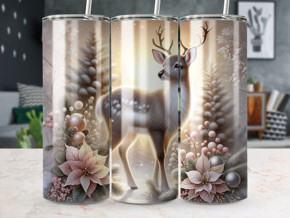 Three cylindrical tumblers stand side-by-side on a marble surface, displaying a continuous winter woodland scene with a deer, pine trees, and poinsettias.