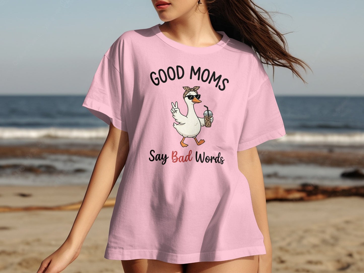 Pink t-shirt with "Good Moms Say Bad Words" text and graphic.