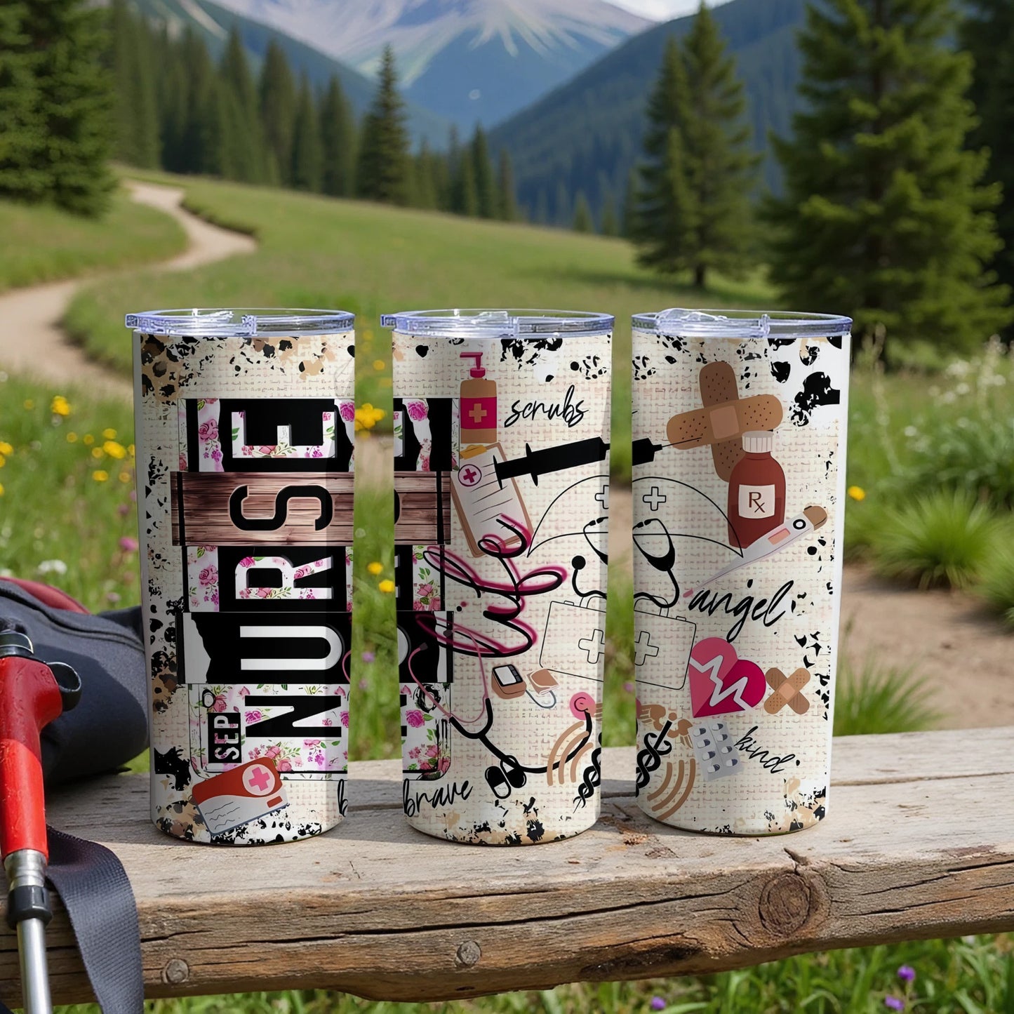 Three tumblers with medical and inspirational nurse-themed designs on a wooden table.