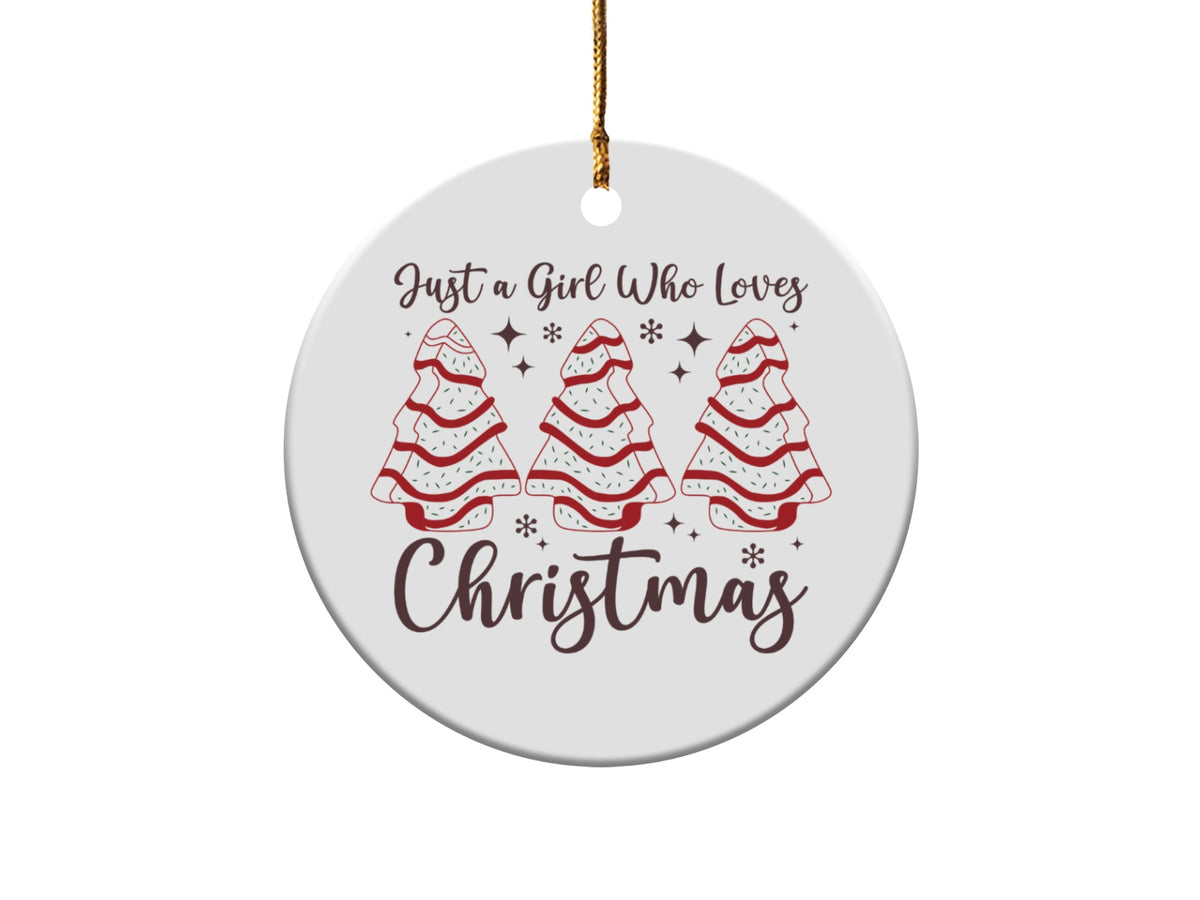 Round ornament with text "Just a Girl Who Loves Christmas" and three decorated Christmas trees.