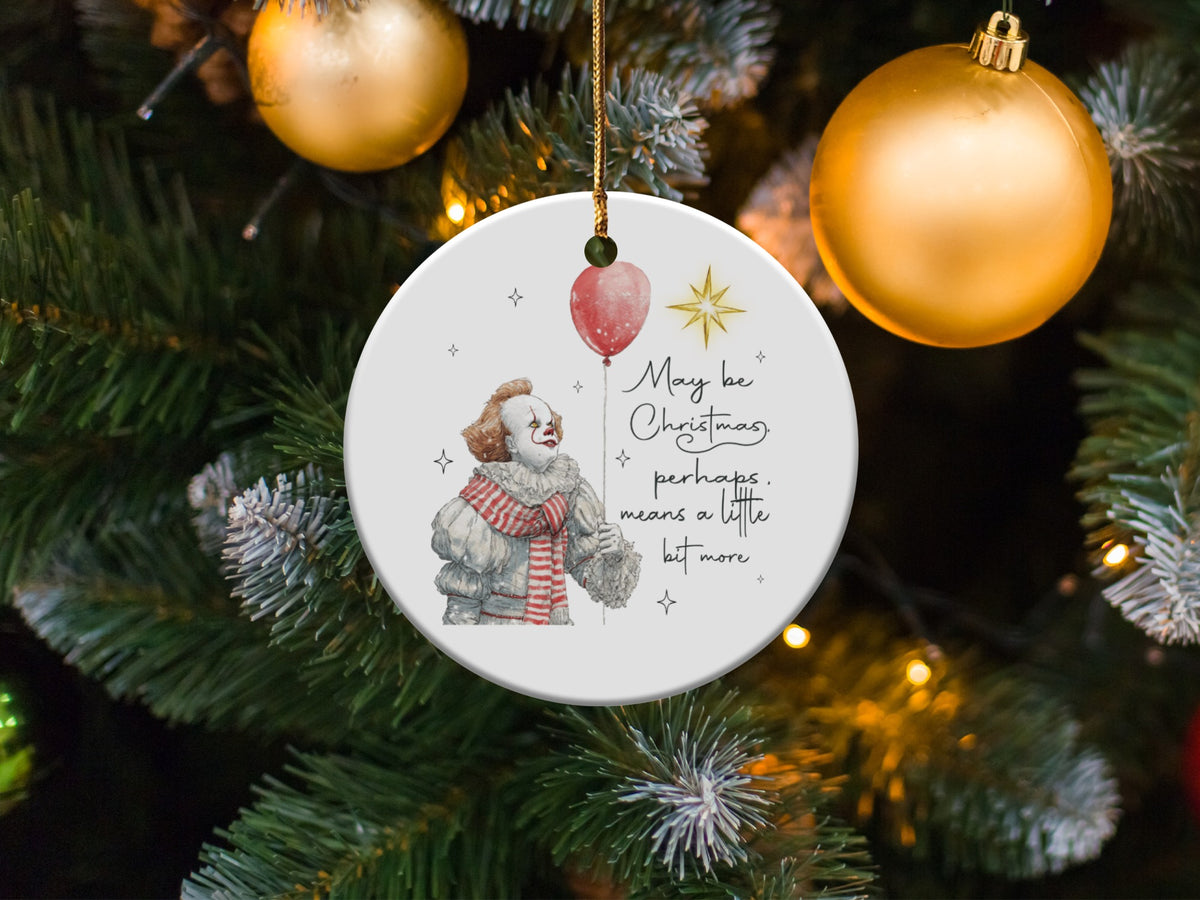 Christmas ornament with clown holding balloon and text "May be Christmas, perhaps, means a little bit more."