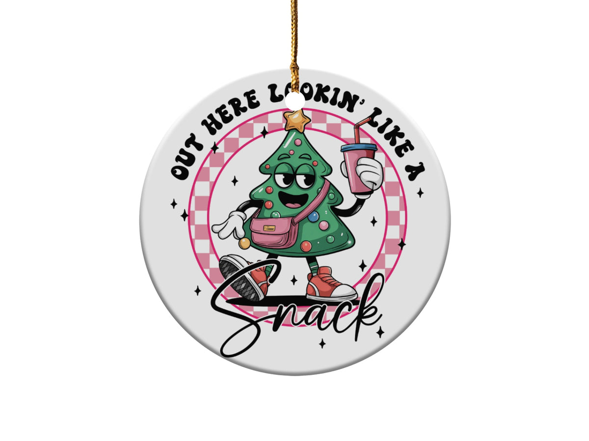 Christmas tree ornament with a sassy cartoon tree saying "Out here lookin' like a snack".