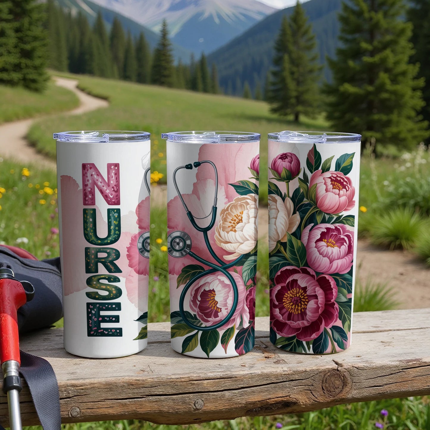 Three tumblers with floral and stethoscope nurse designs on a wooden surface.