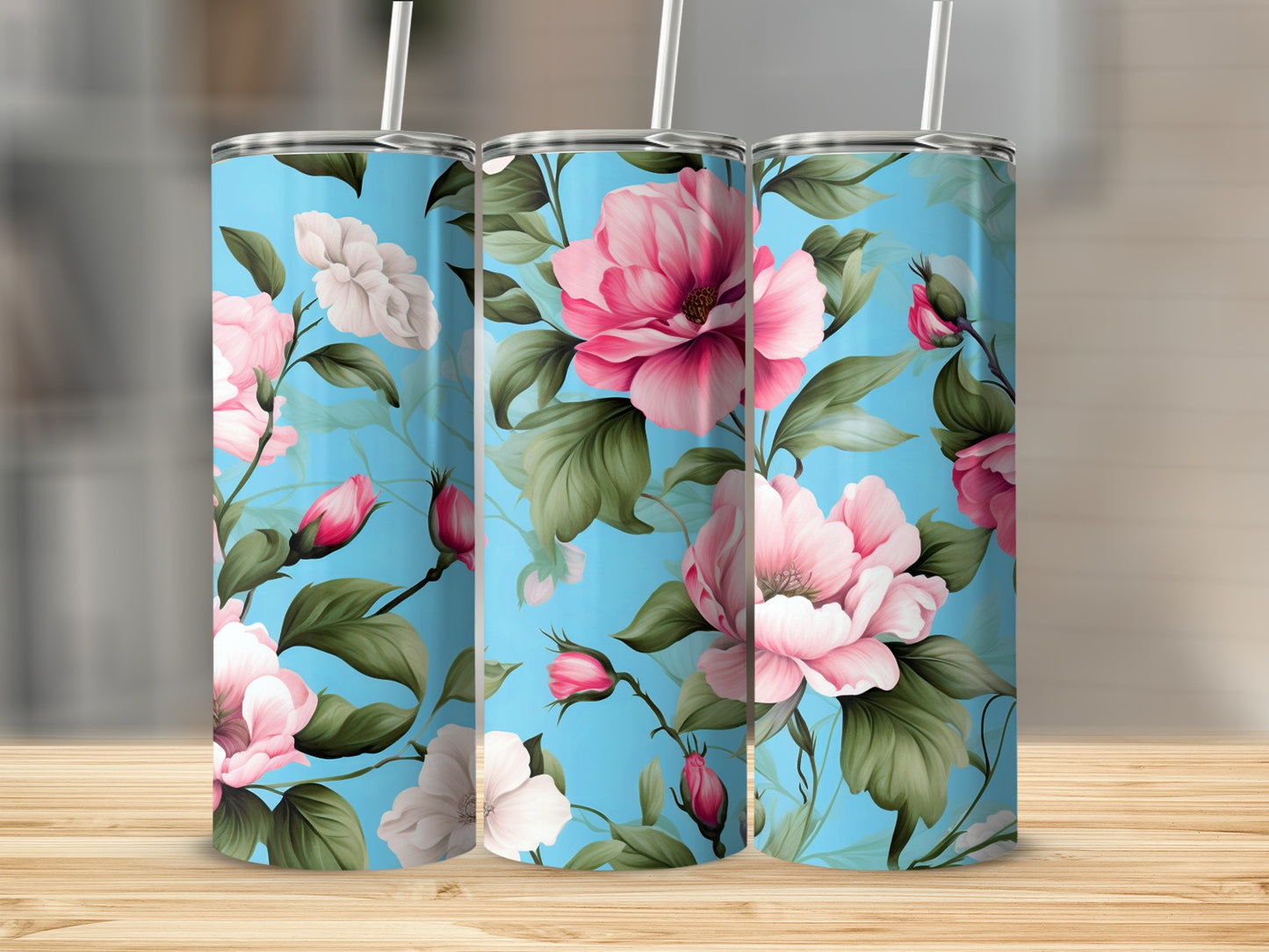 Three blue tumblers with a pink and white floral pattern.