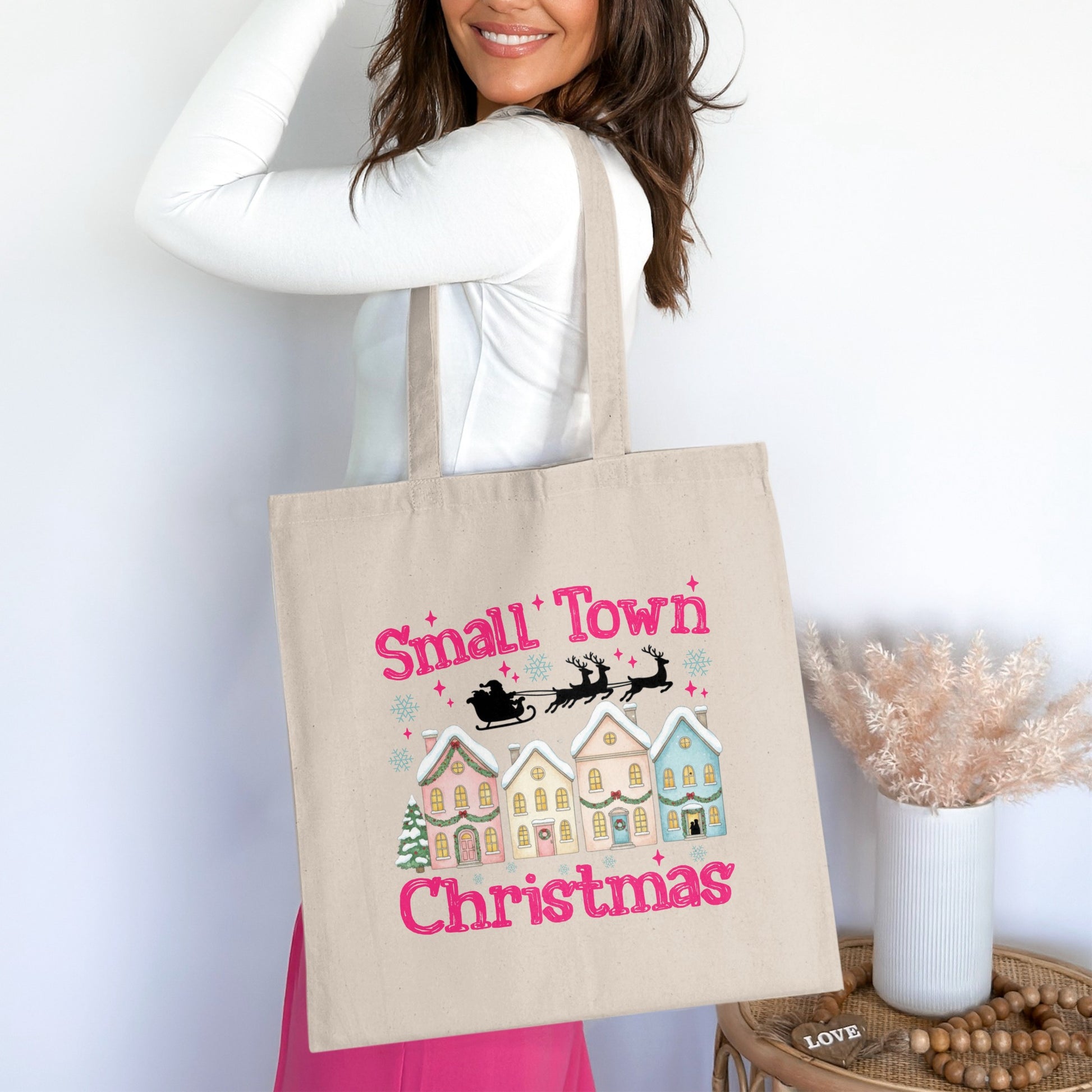 Tote bag with "Small Town Christmas" text, Santa, reindeer, and houses.