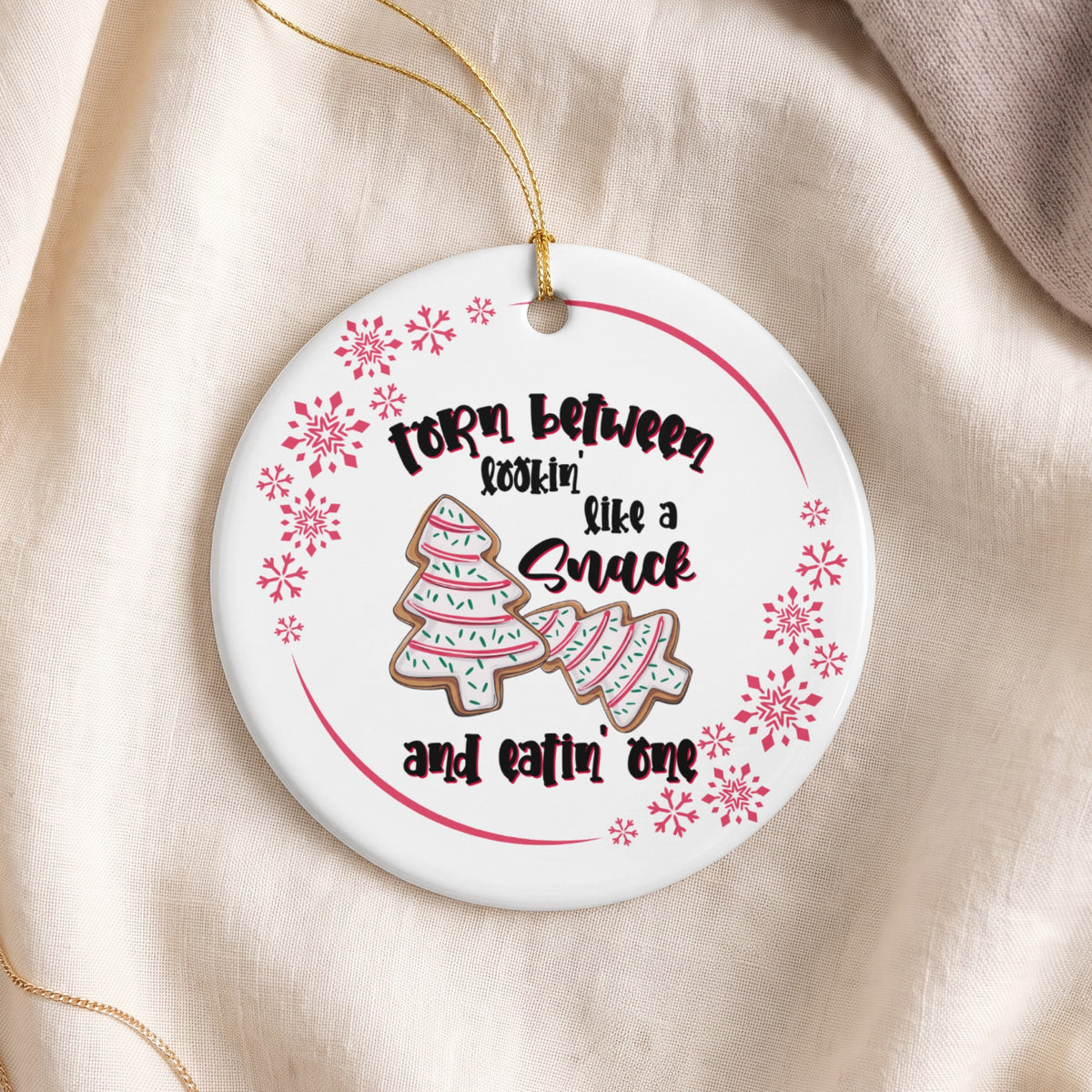 Round ornament with "Torn between lookin' like a Snack and eatin' one" text and gingerbread trees.