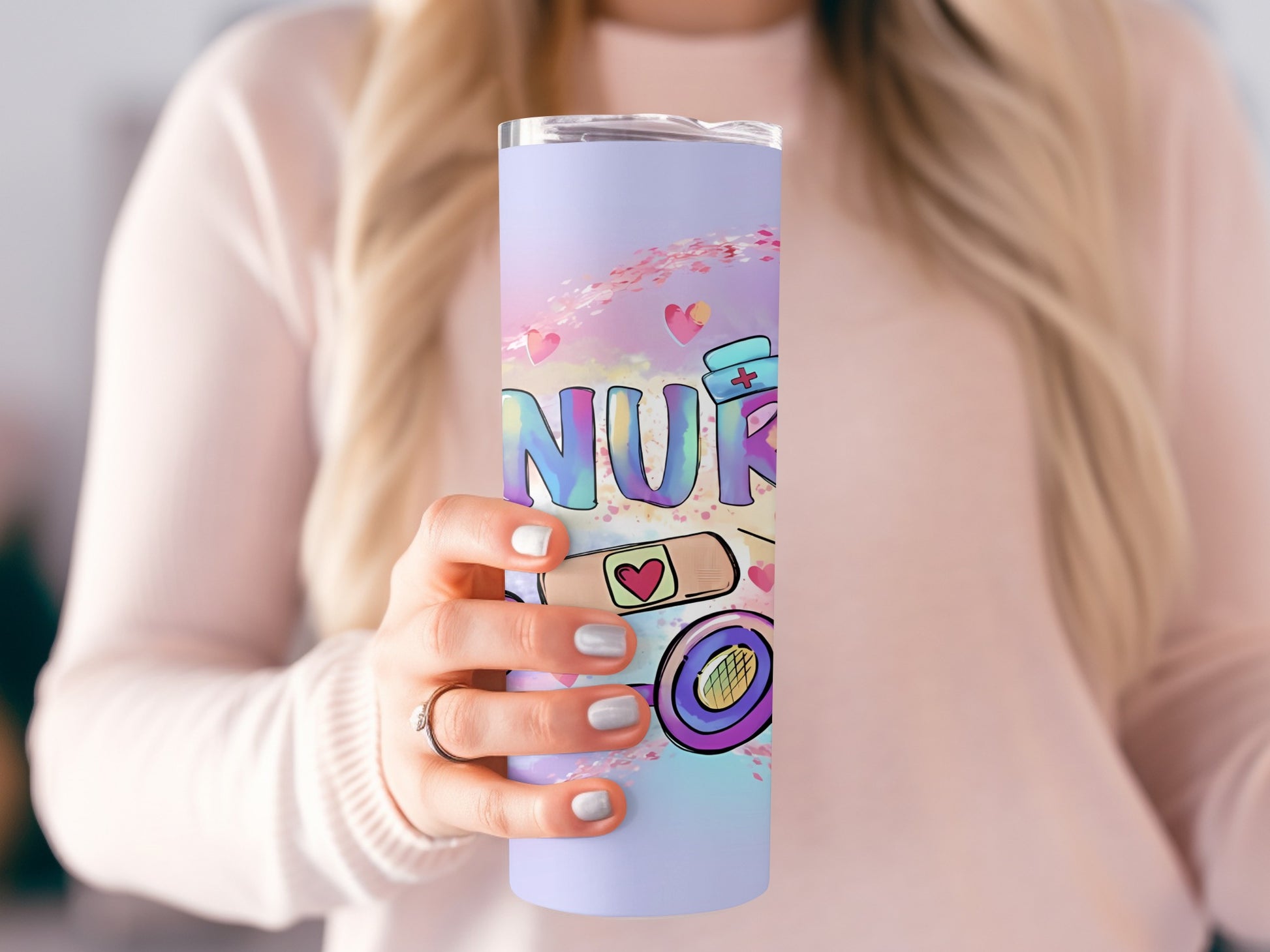 Nurse tumbler with hearts and medical symbols.