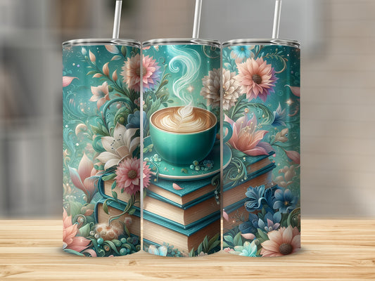 Three tumblers with floral designs and stacked books with a coffee cup.