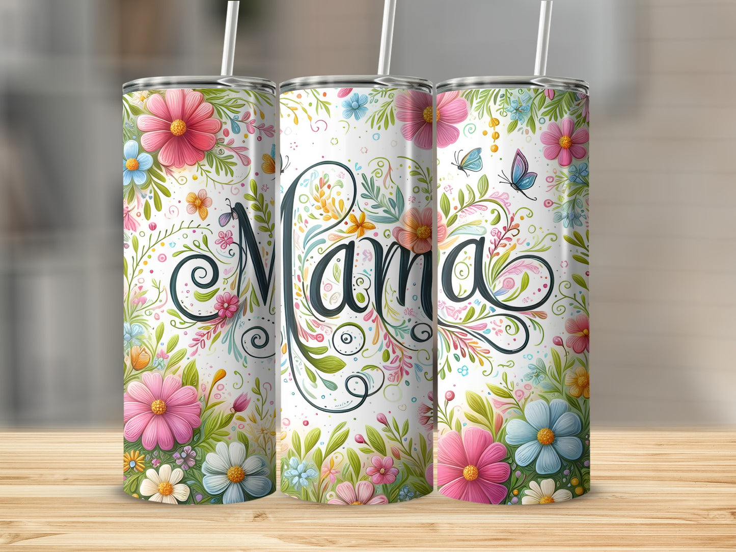 Three floral tumblers with "Mama" script, on a wooden surface.