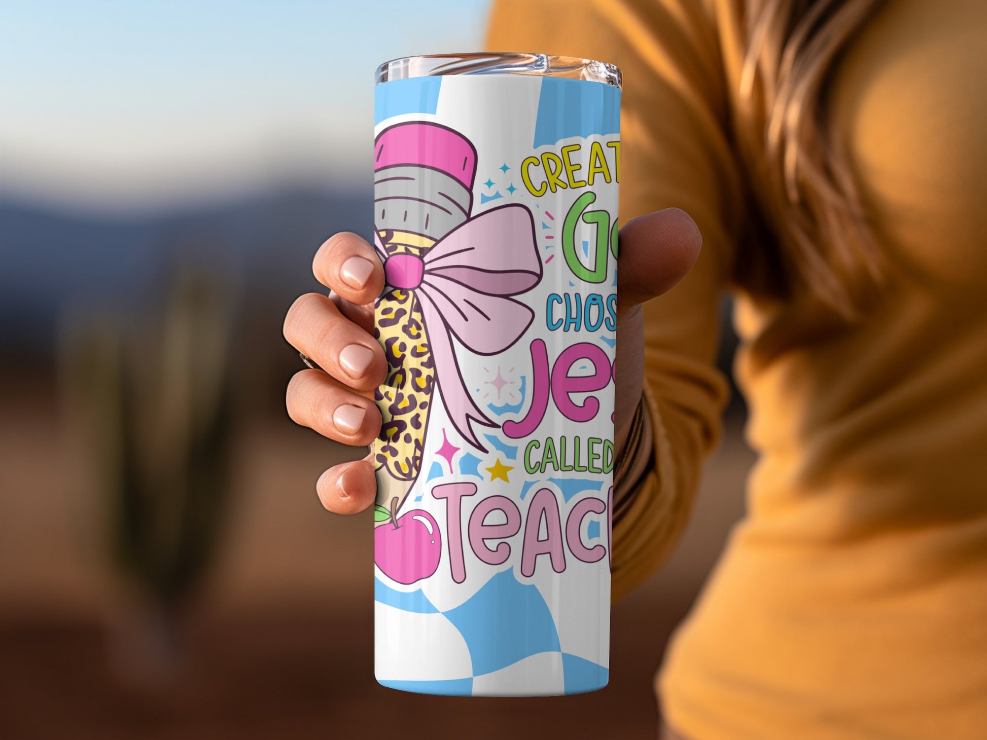 Tumbler with "Great G Chooses Je Called Teach" text and apple graphic.