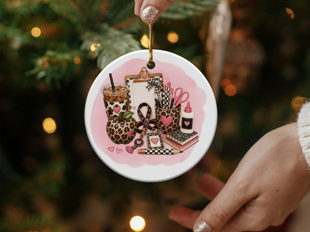 Ornament with teacher's supplies, leopard print, and pink hearts.
