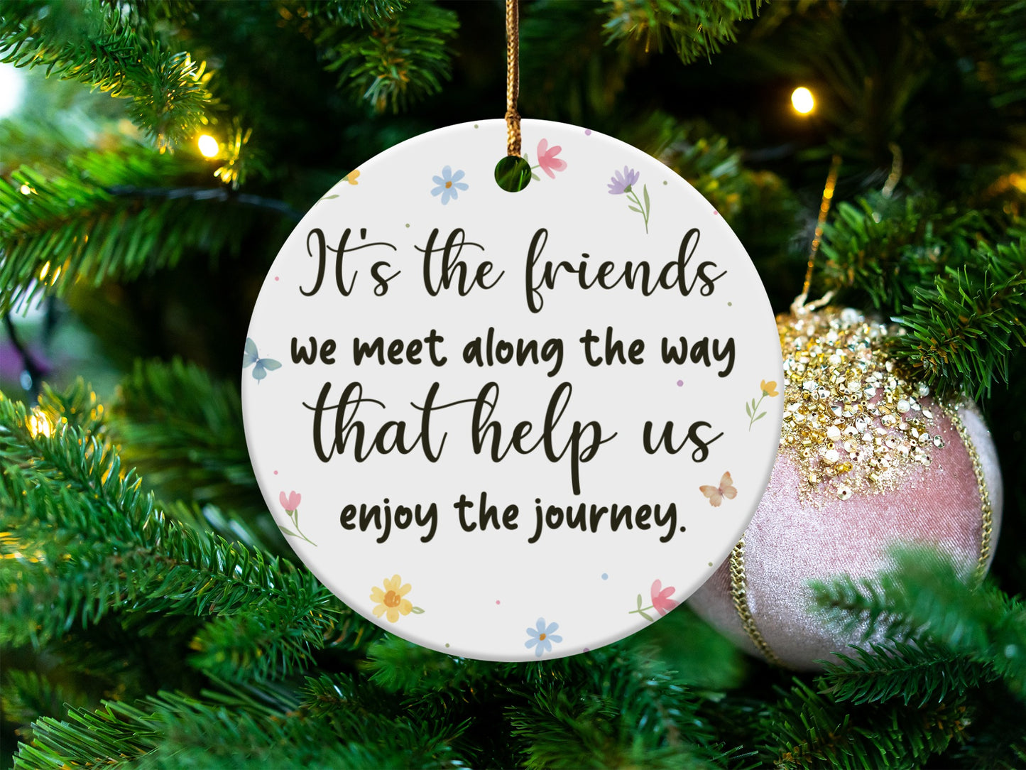 Round ornament with quote "It's the friends we meet along the way that help us enjoy the journey."