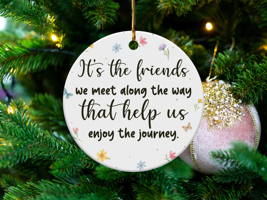 Round ornament with quote "It's the friends we meet along the way that help us enjoy the journey."