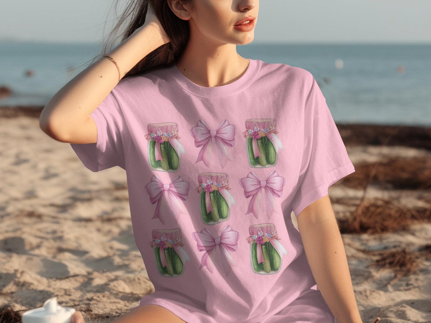 Pink t-shirt with repeating pattern of pickle jars and pink bows.