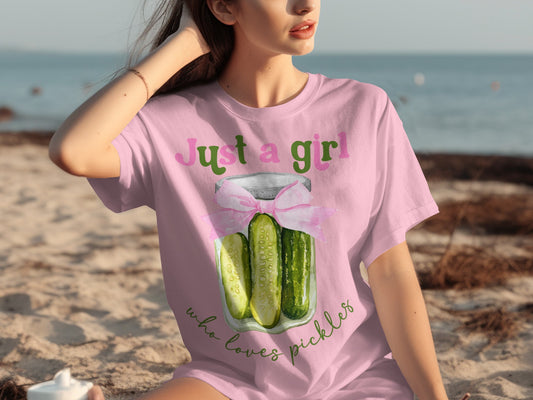 Pink t-shirt with a jar of pickles and "Just a girl who loves pickles" text.