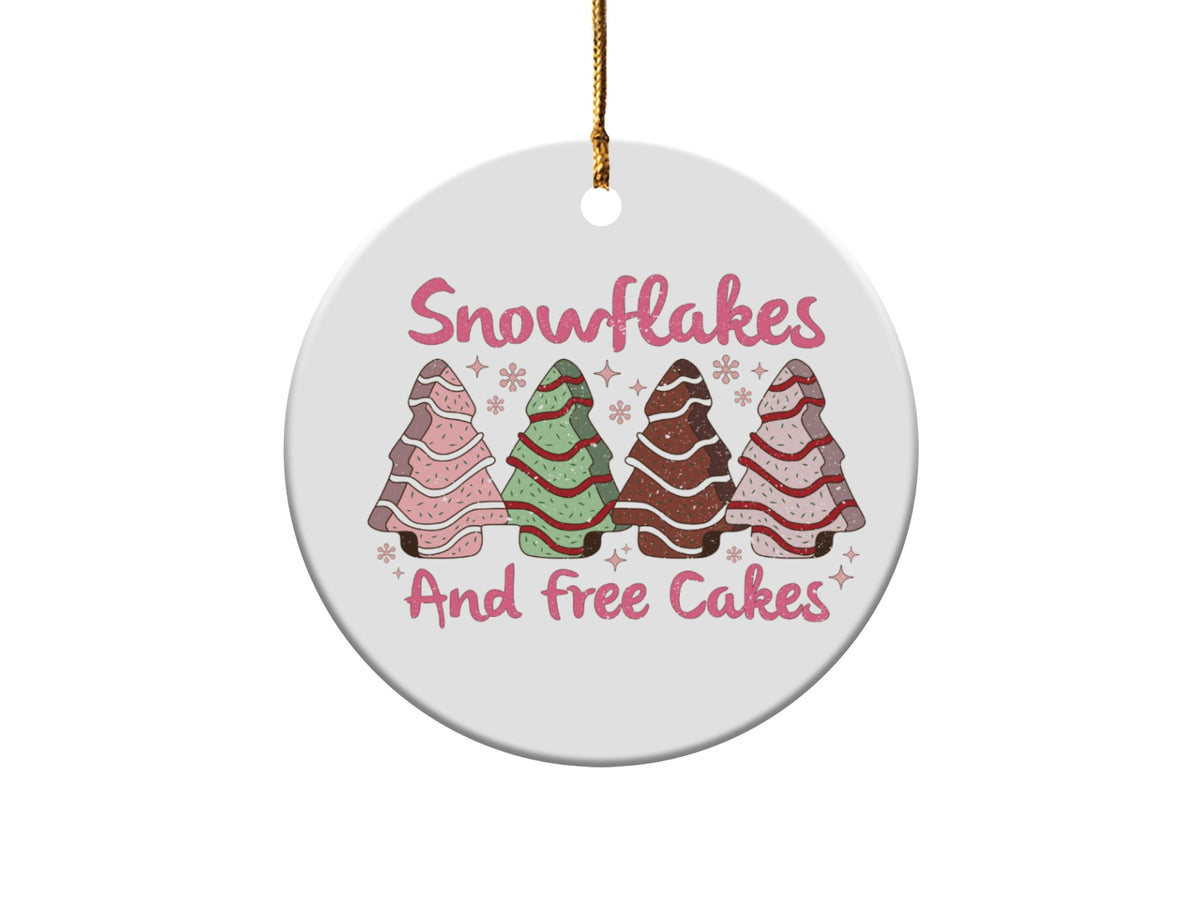 Round ornament with cartoon trees and text "Snowflakes And free Cakes".