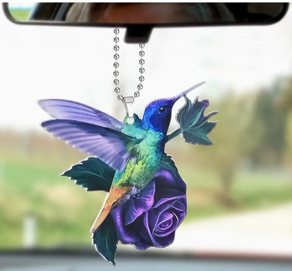 Hummingbird on Purple Roses